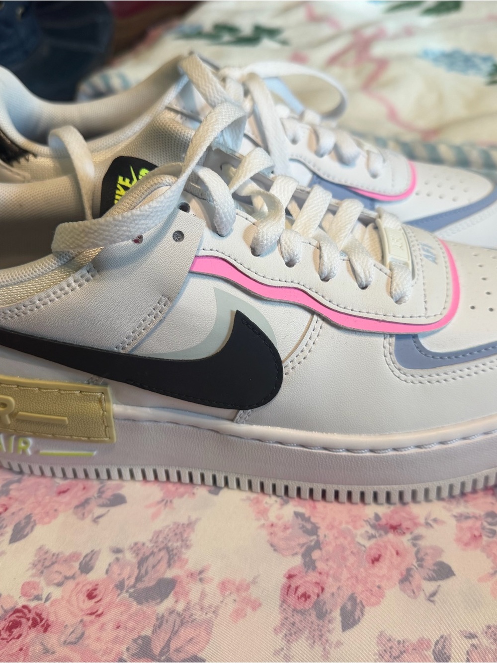 Nike Women’s Air Force One White Sneakers with Pink Trim and Black Swoosh